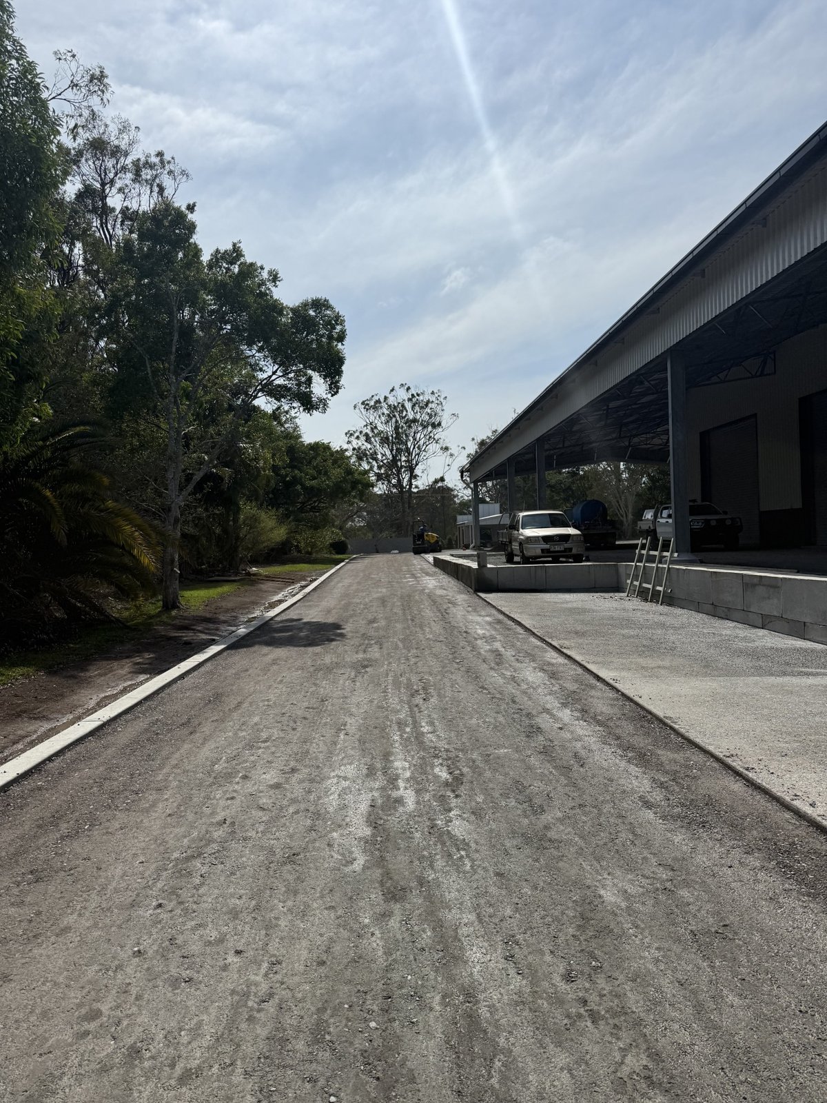 Harth Earthmoving Volvo NL12 tipper truck with excavator on lowloader trailer